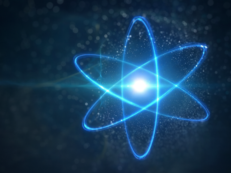 Átomo brilhante em estilo digital, com órbitas luminosas em azul envolvendo um núcleo radiante sobre fundo escuro desfocado, representando ciência e tecnologia.